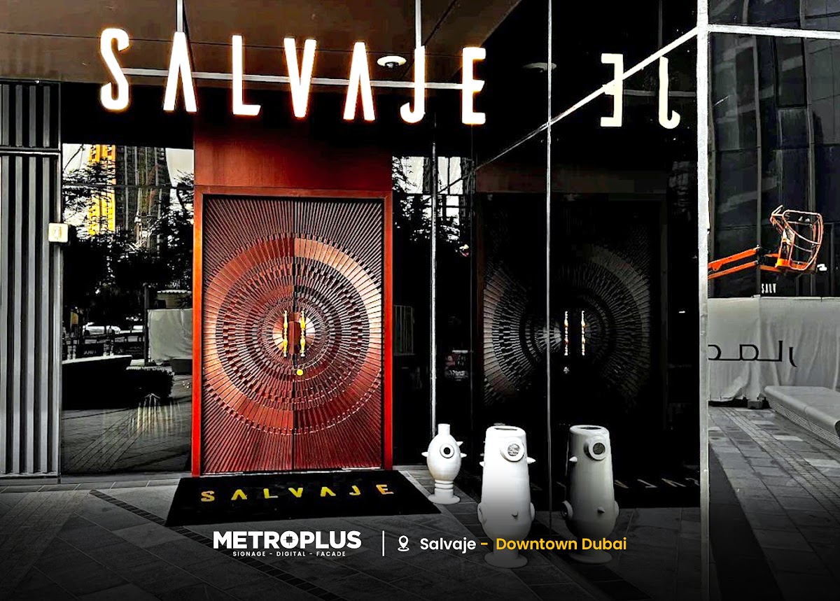 Illuminated Script Signage Above a Sculptural Entrance - Metroplus