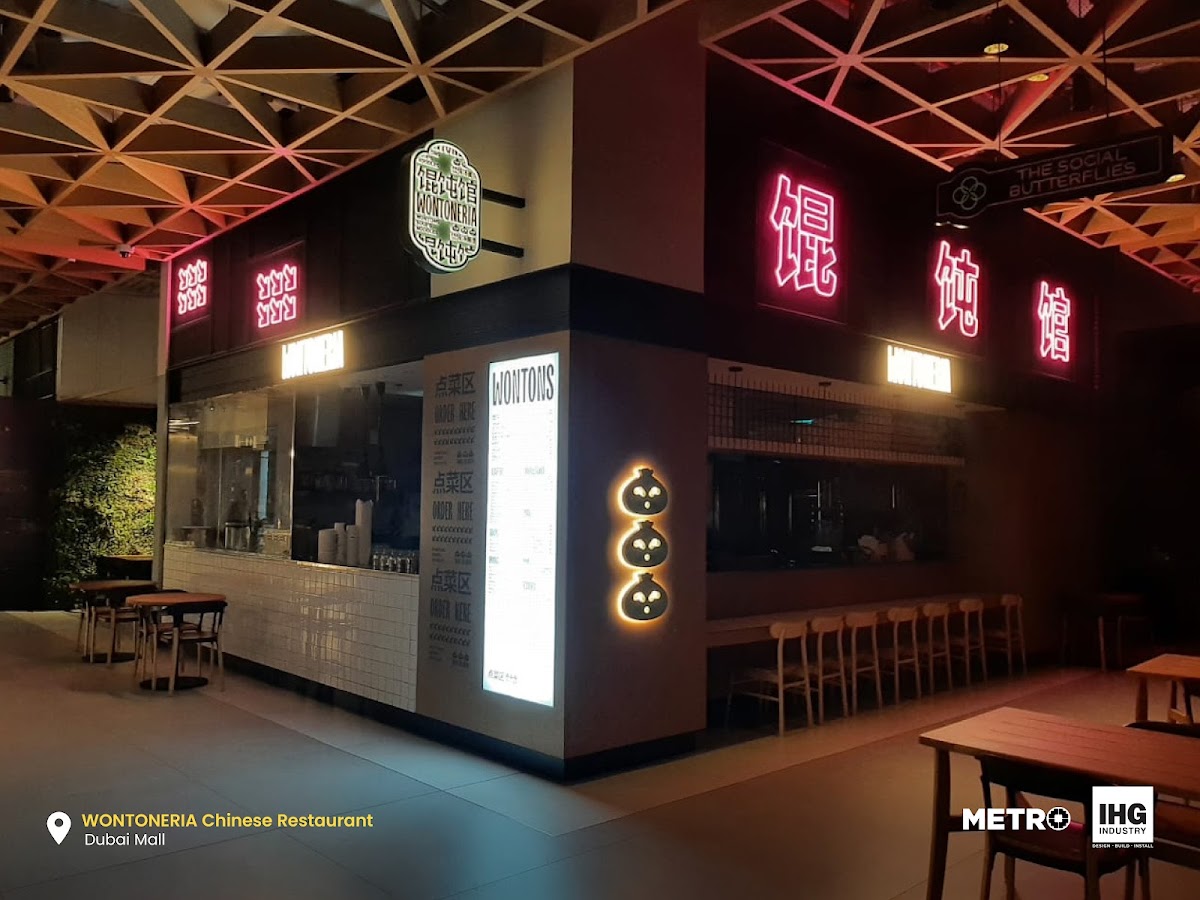 Vibrant Neon Signage with Backlit Icon Panels - Metroplus