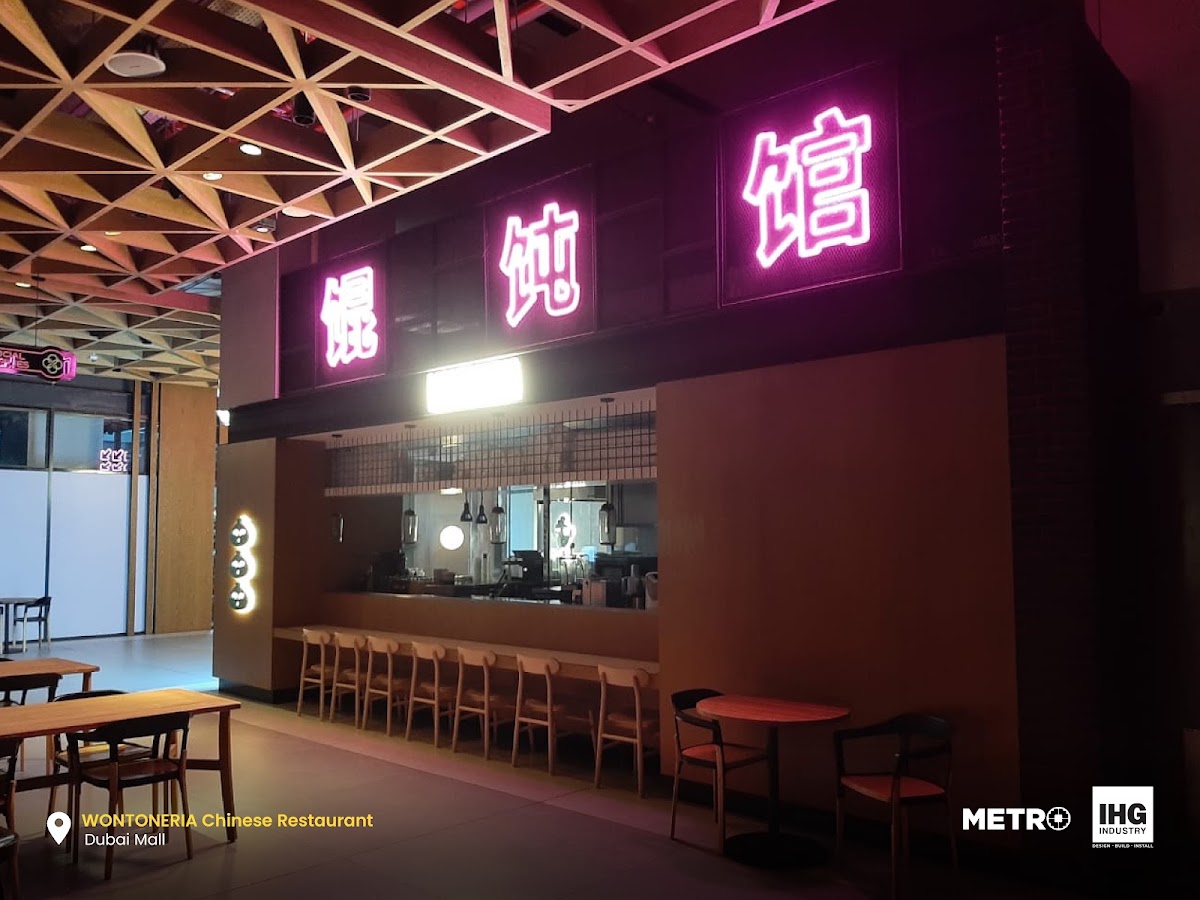 Vibrant Neon Signage with Backlit Icon Panels - Metroplus detail view