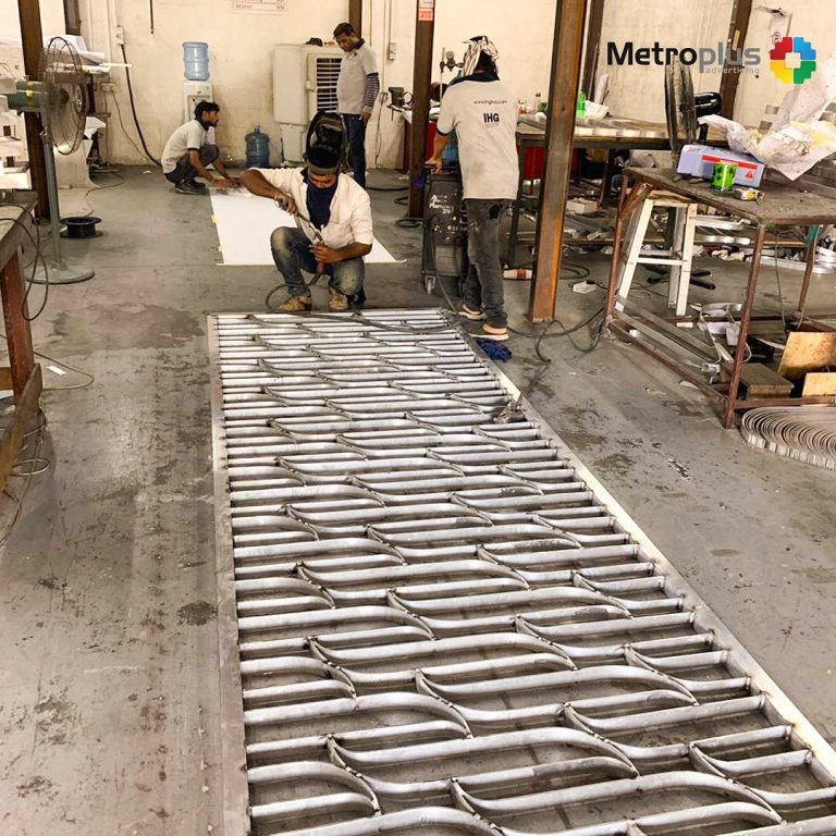 Metroplus in-house team fabricating signage in the workshop