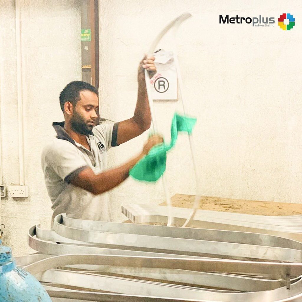 Metroplus in-house team fabricating signage in the workshop