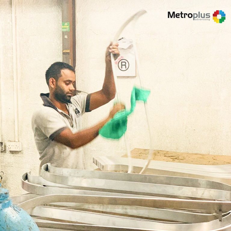 Metroplus in-house team fabricating signage in the workshop