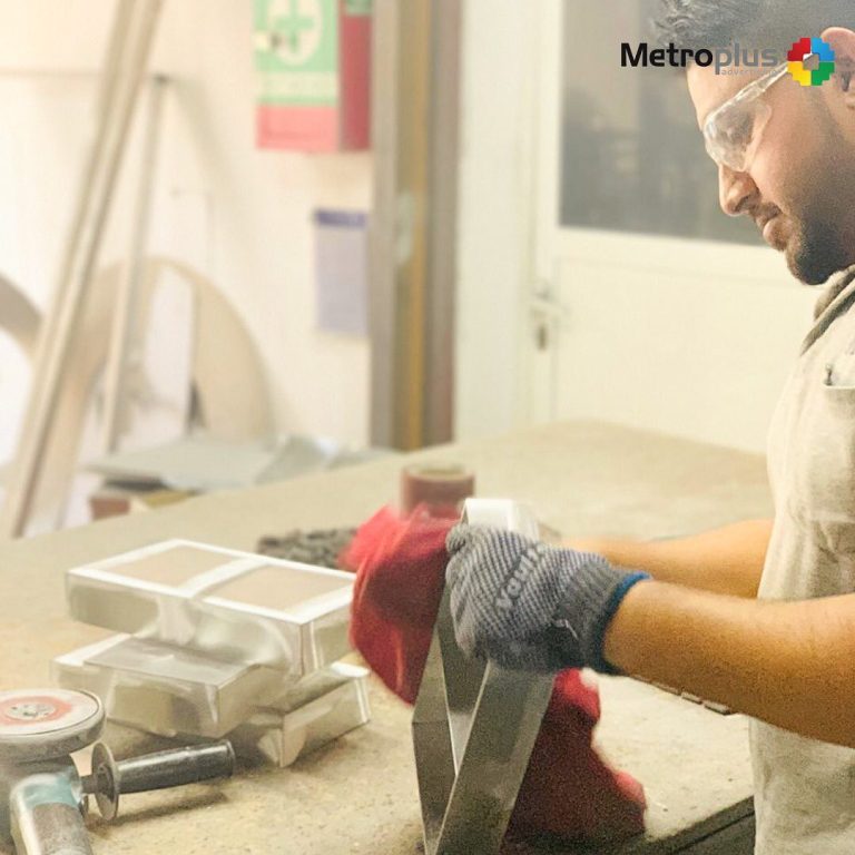 Metroplus in-house team fabricating signage in the workshop